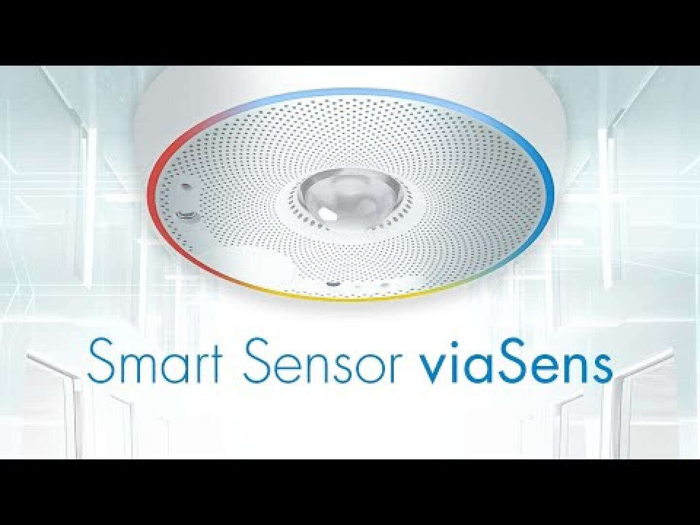 Dispositif de capteur intelligent circulaire sur un plafond avec des accents bleus, jaunes et rouges, représenté au-dessus du texte Smart Sensor viaSens dans un environnement moderne et lumineux.