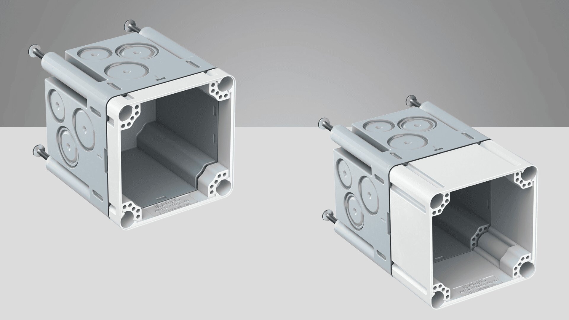 Zwei graue Kunststoff-Verteilerkästen mit offenen Fronten, runden Ausbrechplatten an den Seiten und angebrachten Schrauben, dargestellt auf einem hellgrauen und weißen Hintergrund.