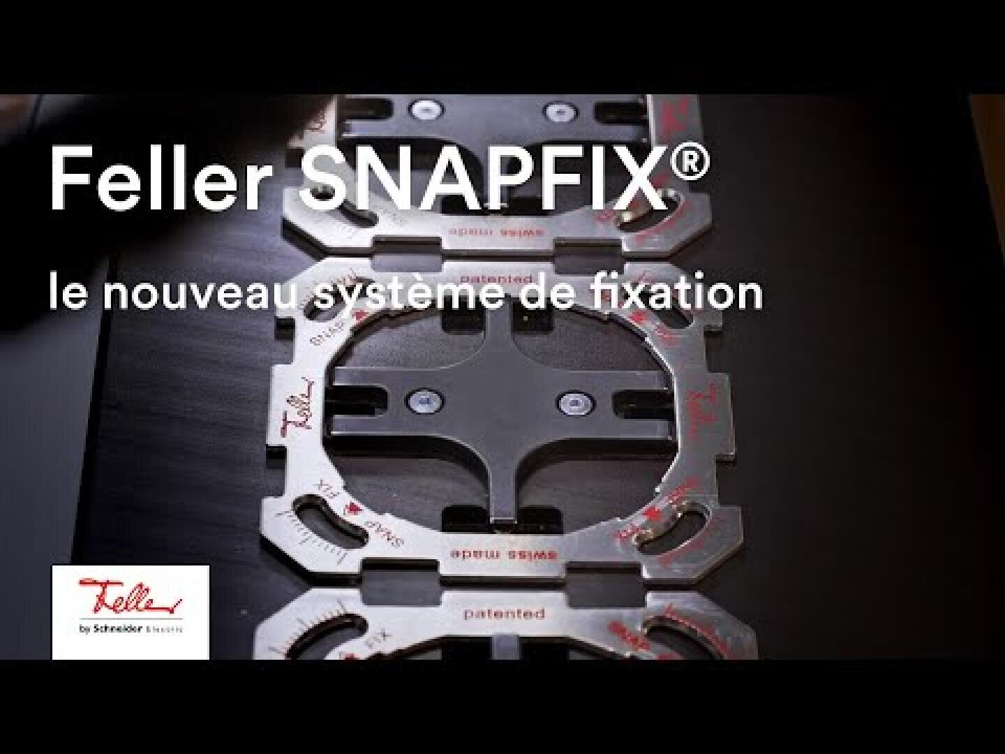 Des supports de fixation métalliques portant la mention « Feller SNAPFIX® : le nouveau système de fixation » sont présentés sur un fond sombre, mettant en avant ce nouveau système de fixation. Le logo Feller by Schneider Electric apparaît dans le coin inférieur gauche.