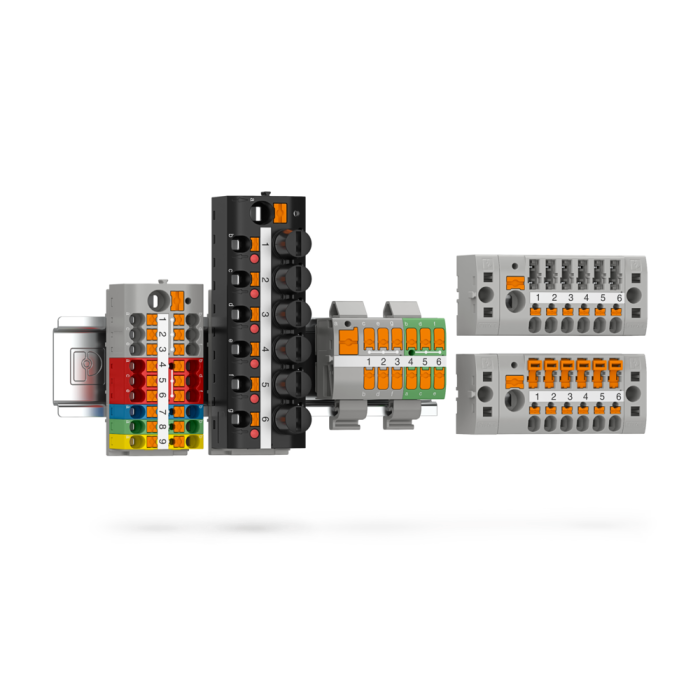 Eine Vielzahl von Reihenklemmen in verschiedenen Farben und Ausführungen, nebeneinander angeordnet auf einem schlichten weißen Hintergrund.